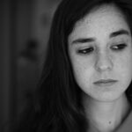 grayscale photo of woman wearing collared shirt